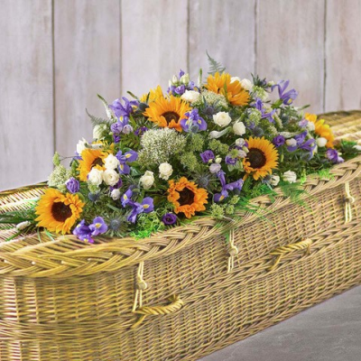 Double ended spray - A sunflower coffin spray is a floral arrangement typically designed to adorn a casket during a funeral or memorial service. Sunflowers are often chosen