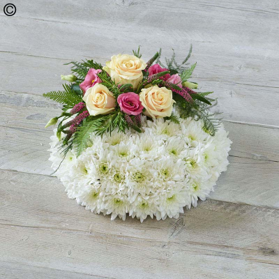 Posy SYM-344 - A delightful funeral posy featuring a white massed base and a red rose spray, handmade by our in-house florists using market fresh flowers.